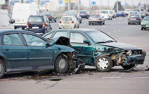 car crash accident on street, damaged automobiles after collision in city