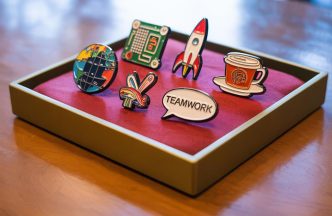 unexpected roi of custom pins for corporate gifting & events